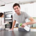 Kitchen Remodeling, man cleaning hist kitchen counter