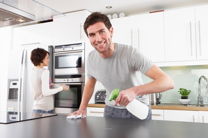 Kitchen Remodeling, man cleaning hist kitchen counter