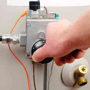 Salt Lake City, UT water heater services, man turning dial